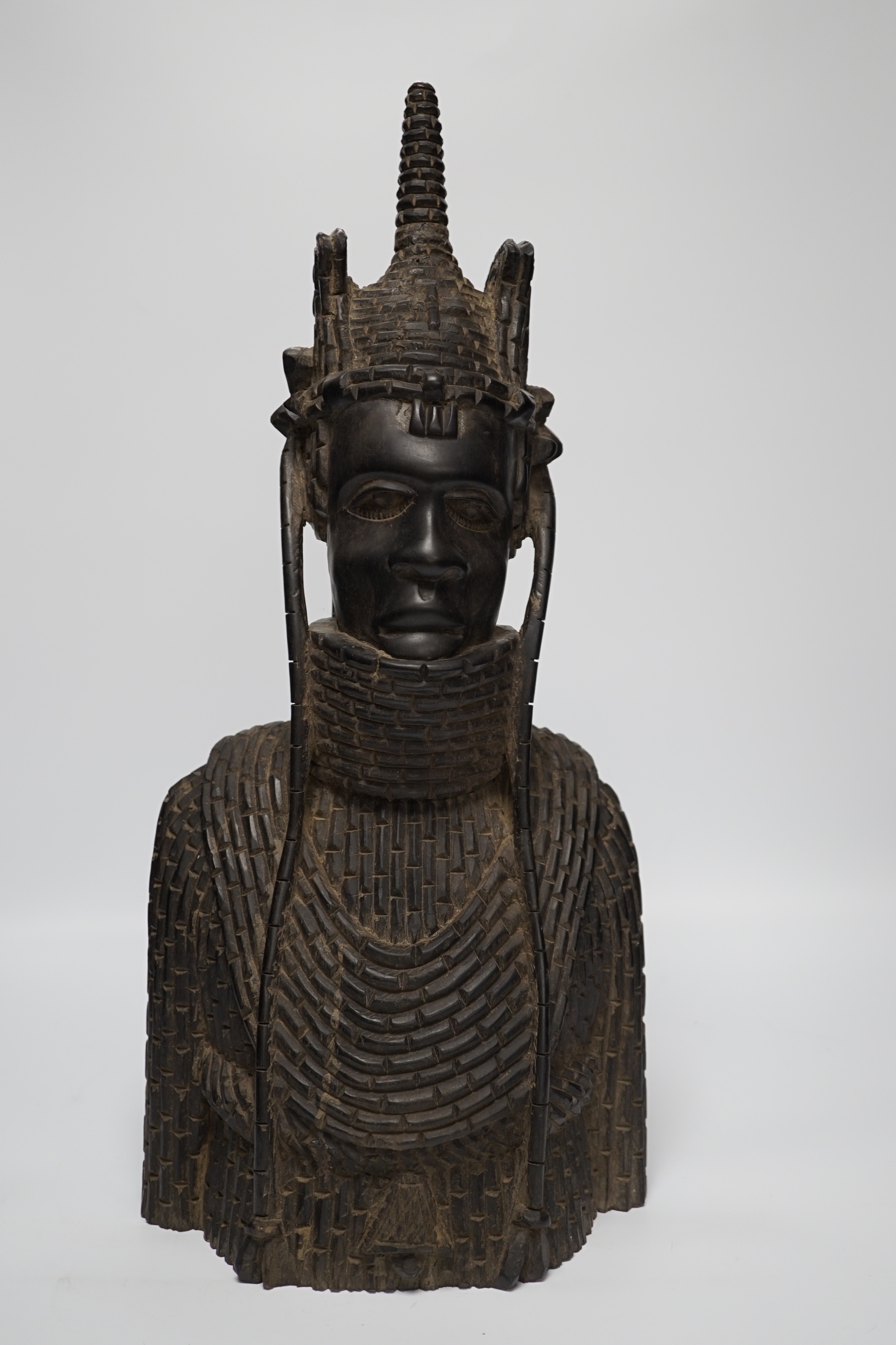 A heavy African ebony carved bust of a warrior, in Benin style, 48cm high